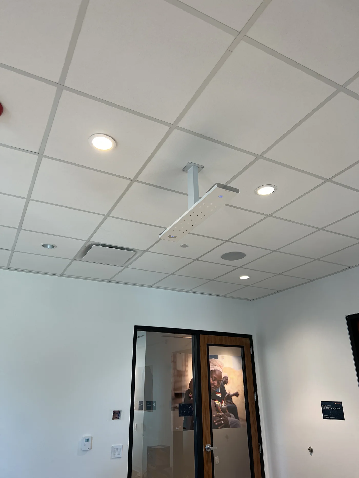 Ceiling-mounted device installation in a commercial room