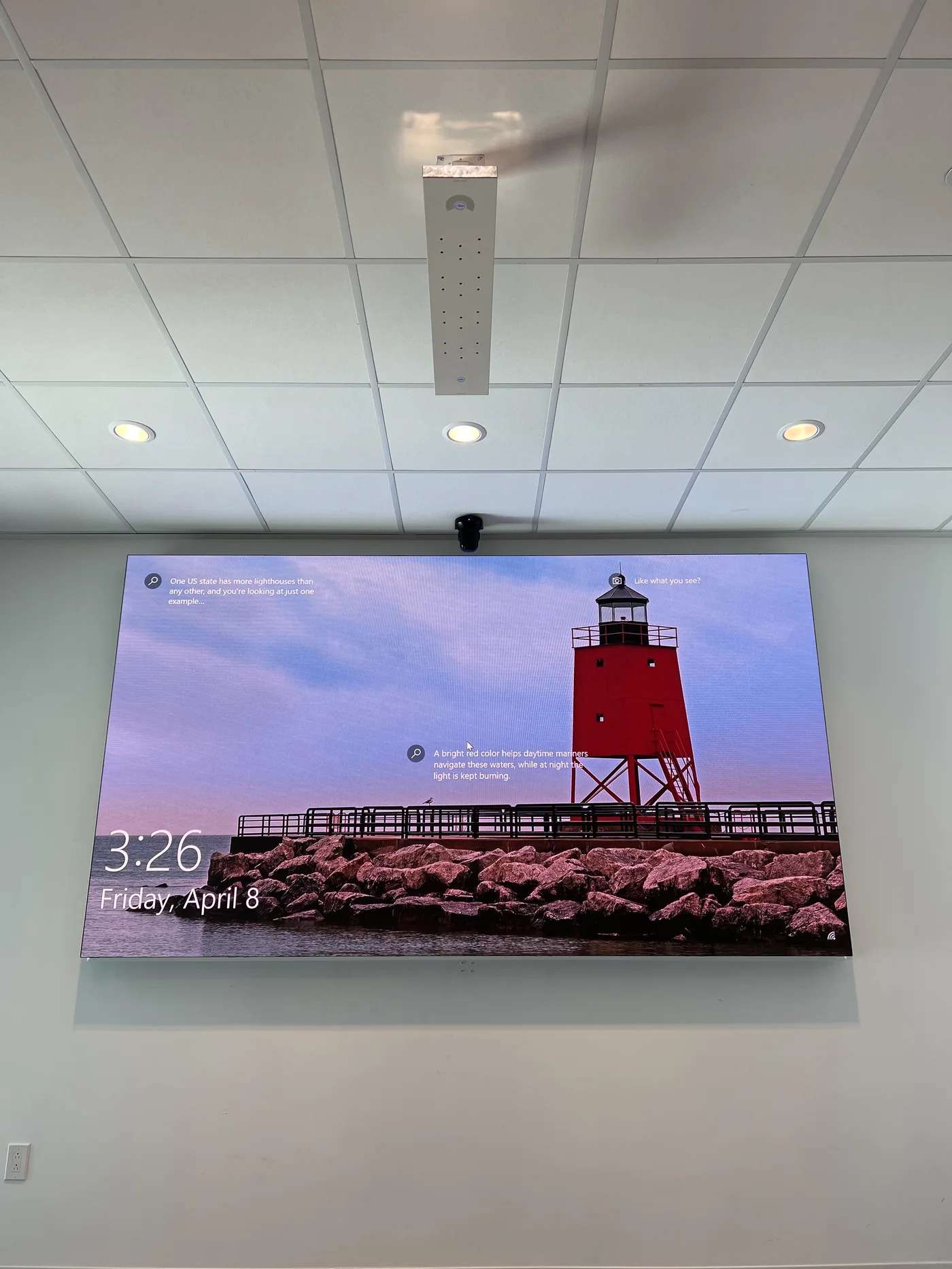 Large wall-mounted display in a conference room environment