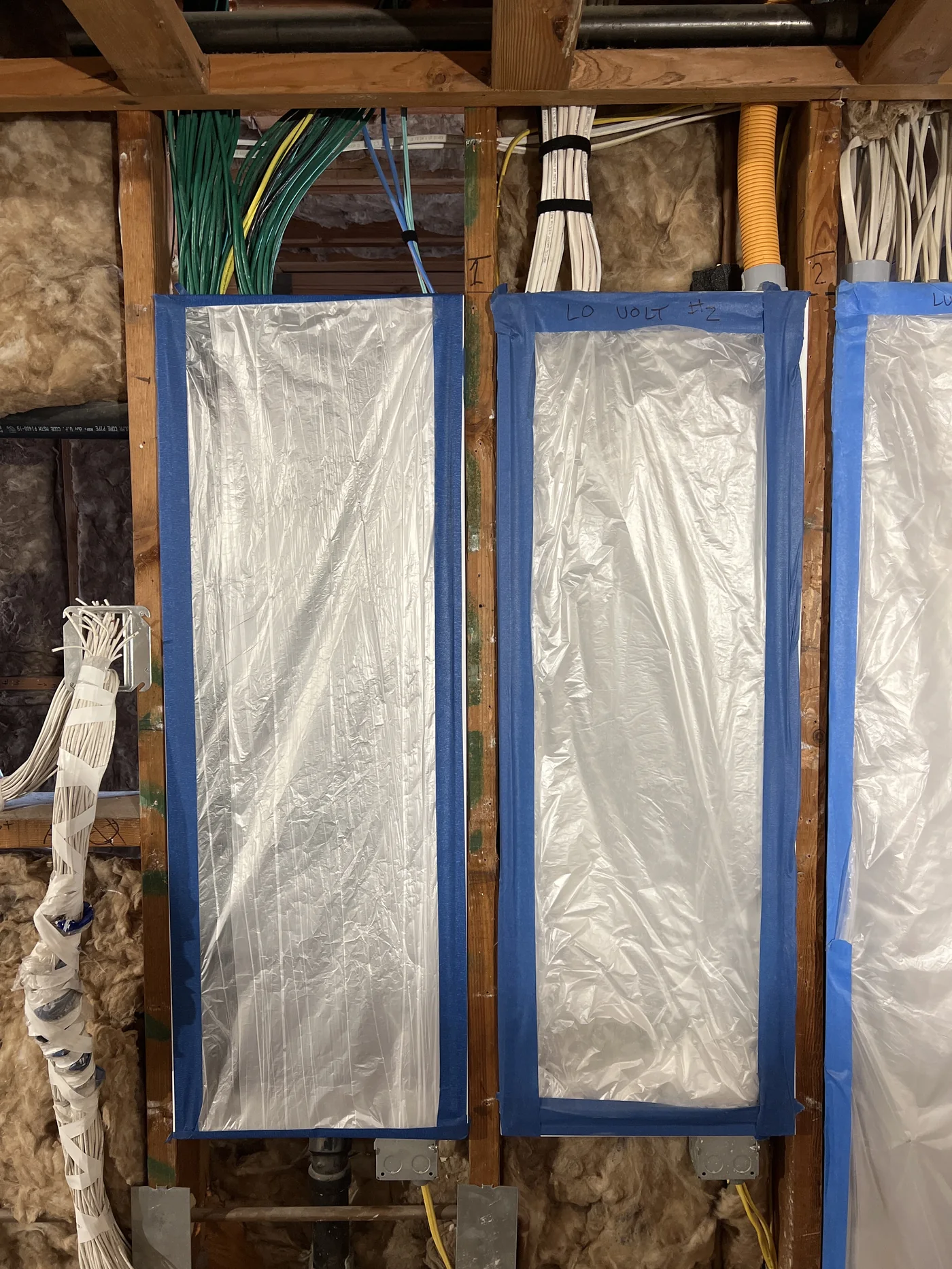 Low-voltage prewire runs in an unfinished wall