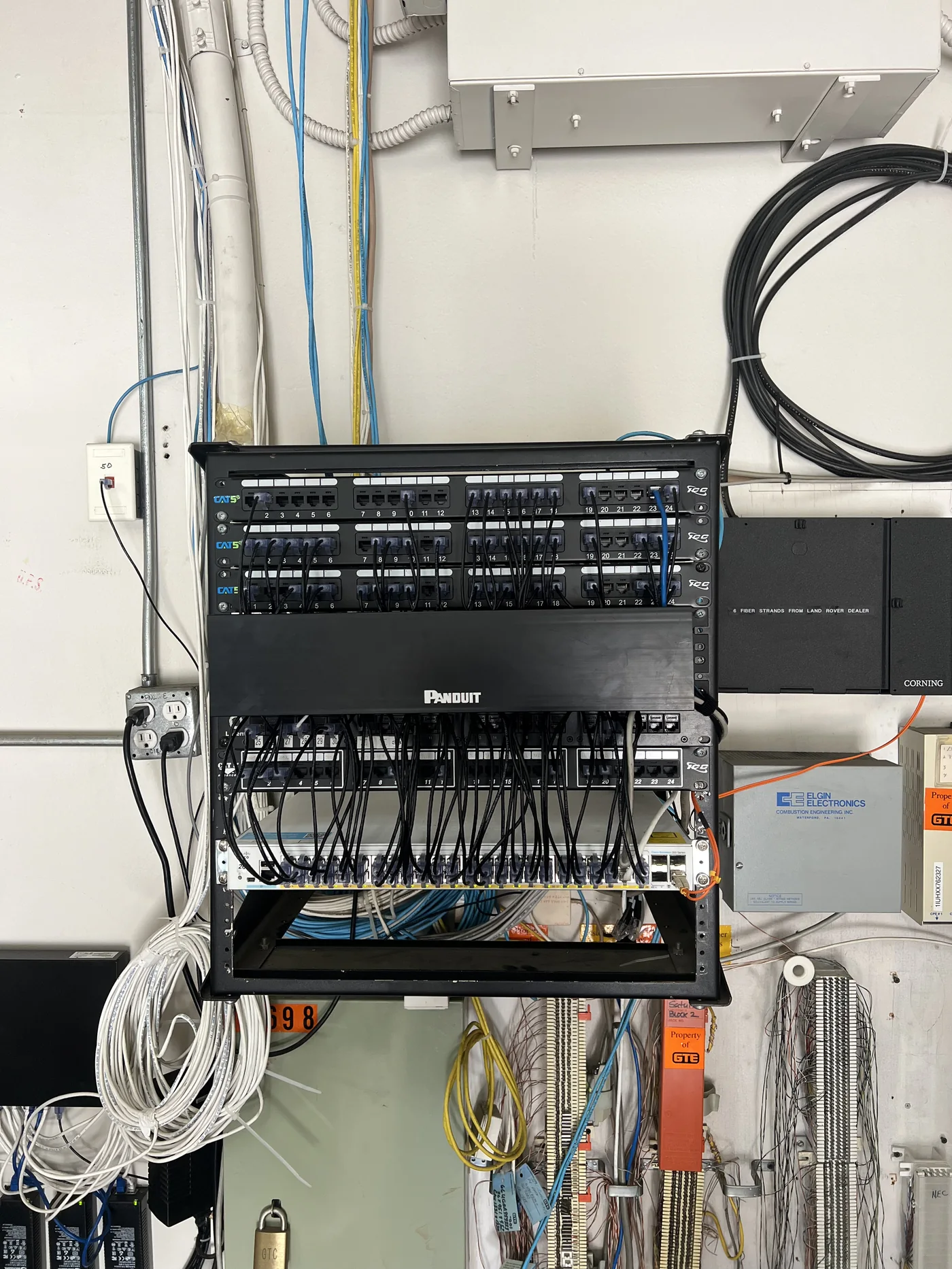 Wall-mounted network patch panel and cable infrastructure