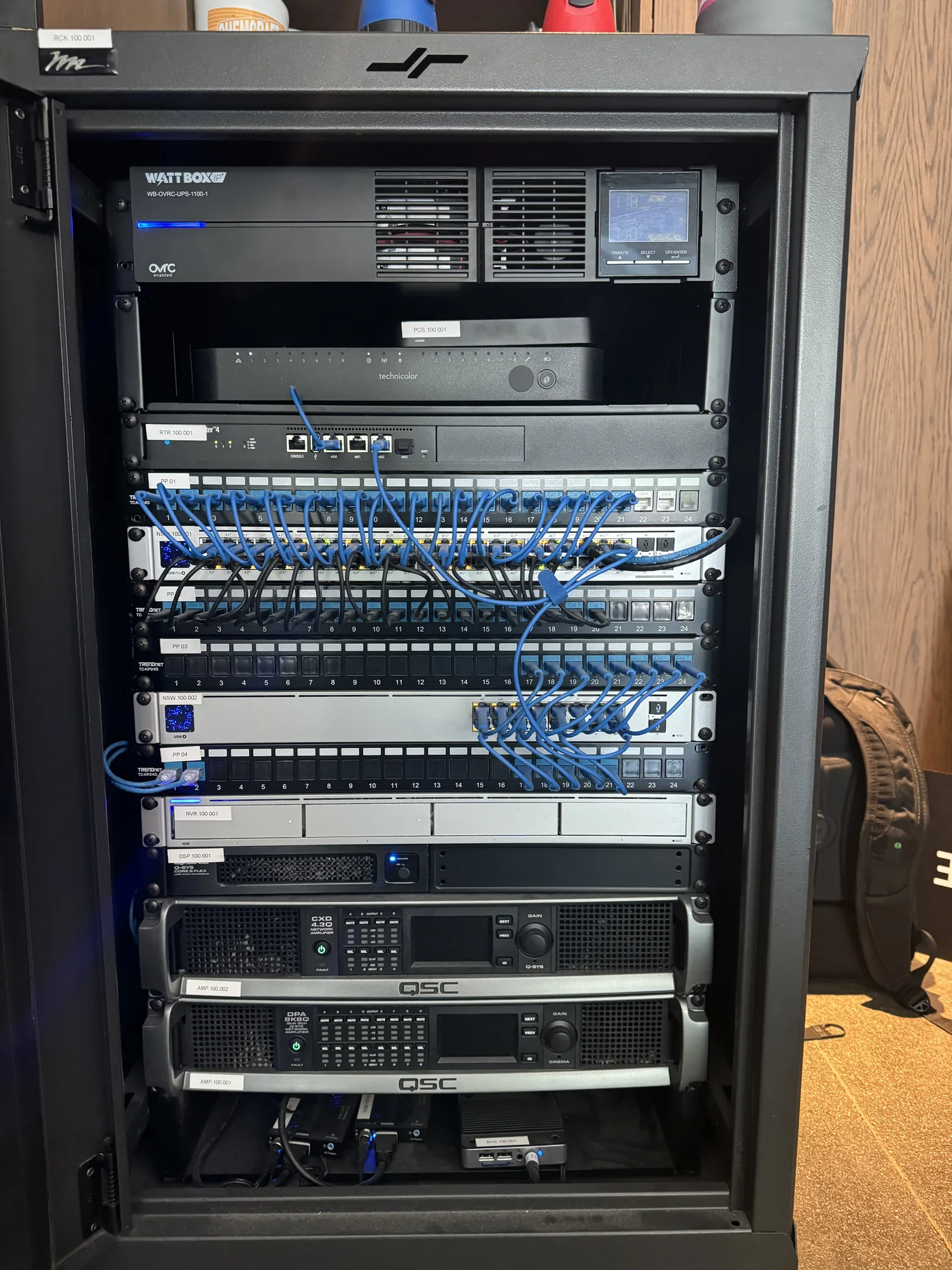 Integrated equipment rack with networking, power, and AV hardware